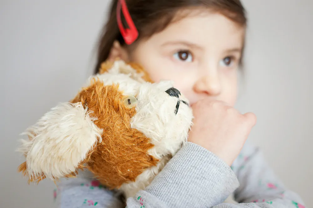 preschooler with stuffed animal