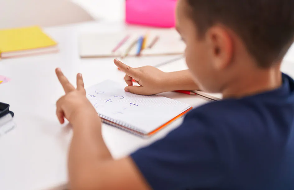 boy counting on fingers