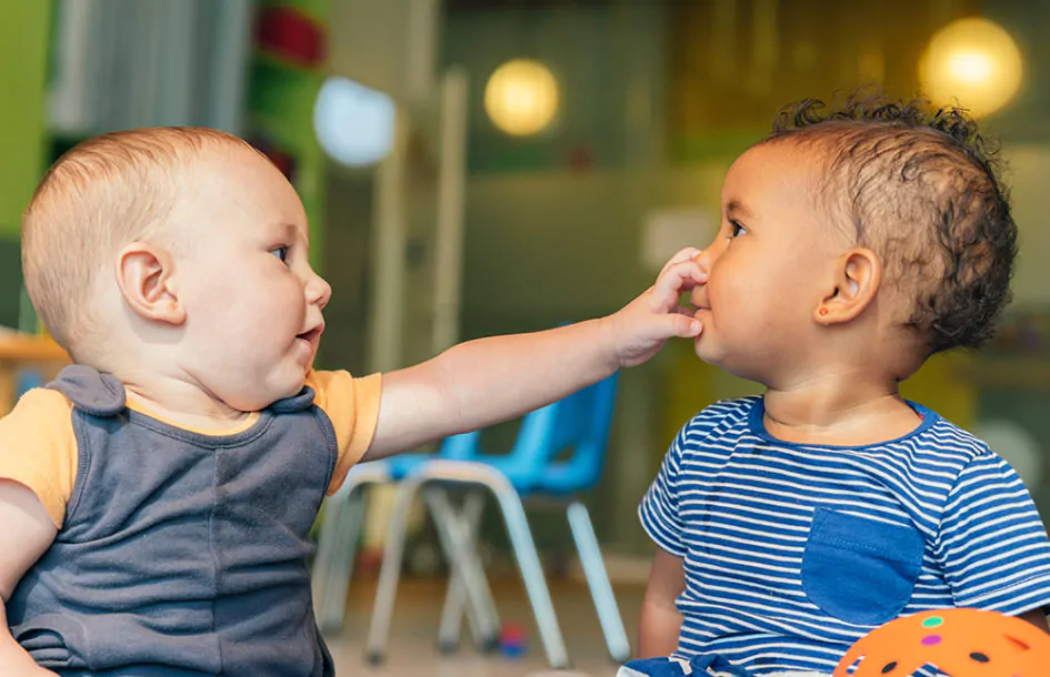 Babies playing together in Childcare