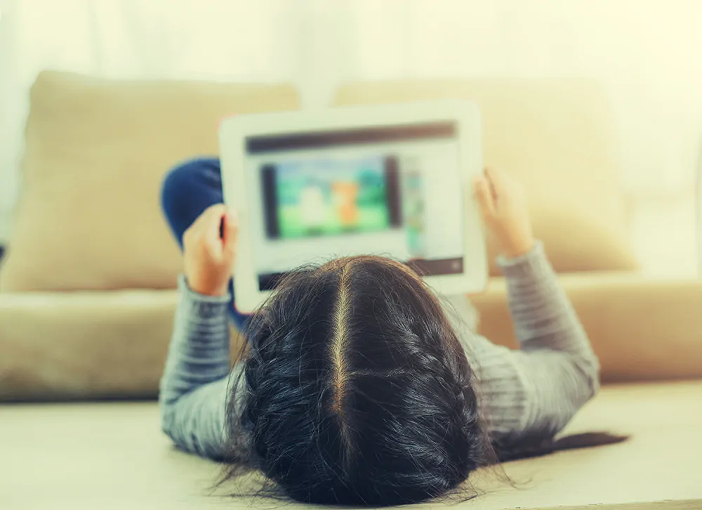 girl watching her tablet