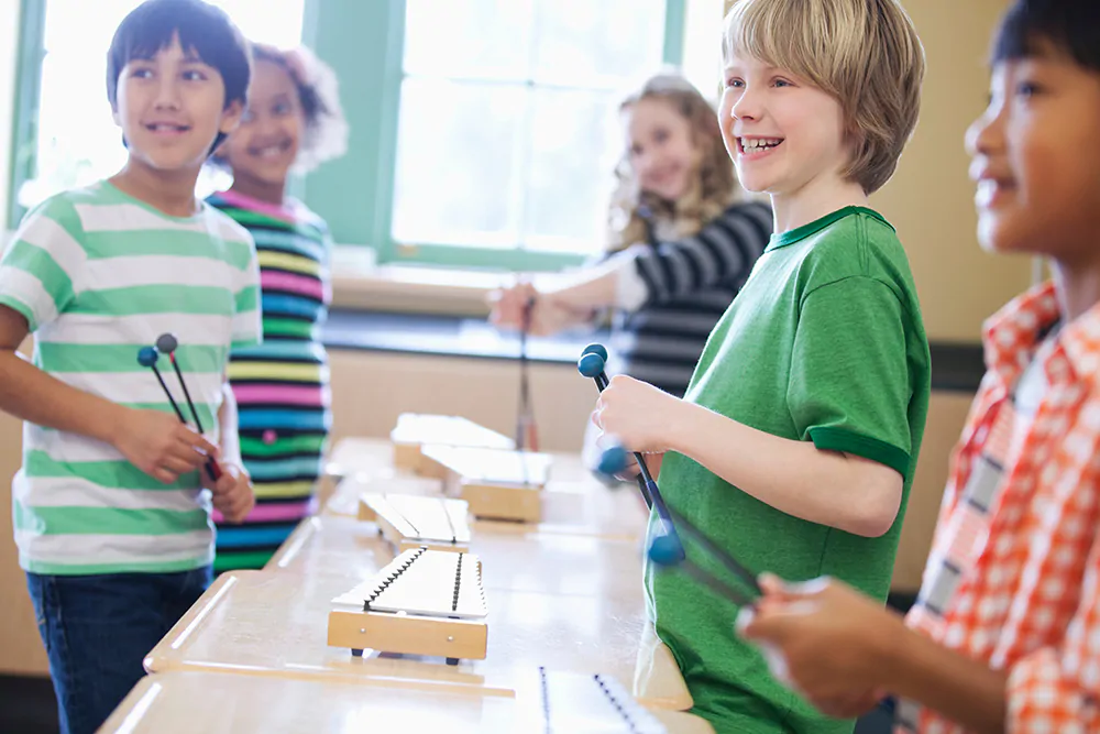group of kids with xylophones