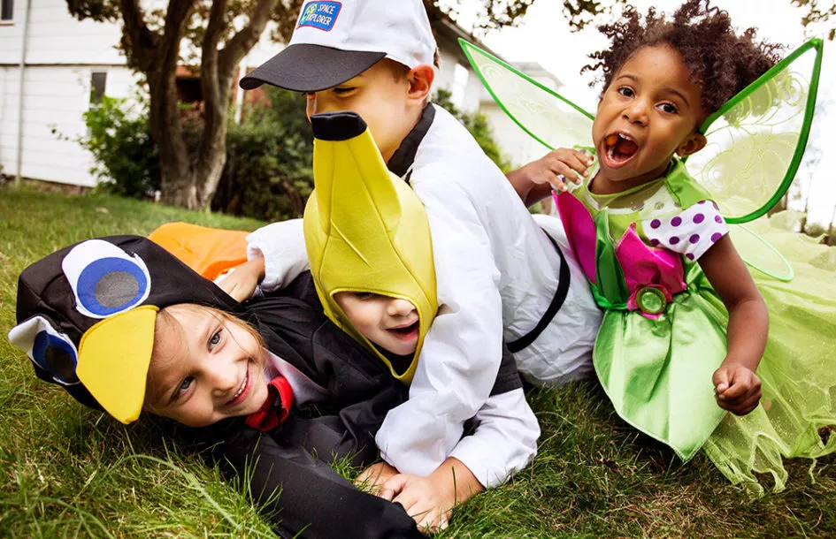 Preschoolers playing together in costumes