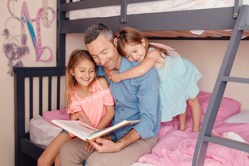 preschoolers getting ready for bed and reading with dad