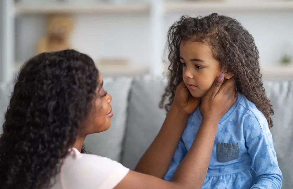 Mother comforting her preschooler