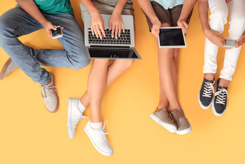 kids with different devices on color background, top view