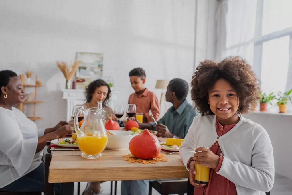 Family enjoying breakfast together at the table.