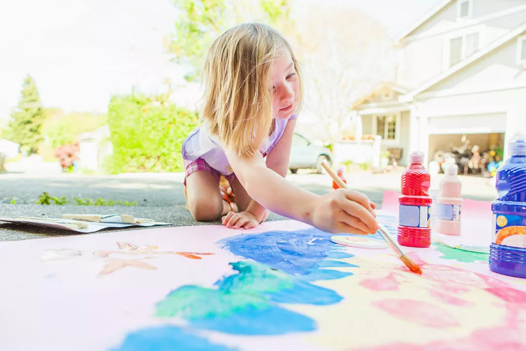 Girl painting outside
