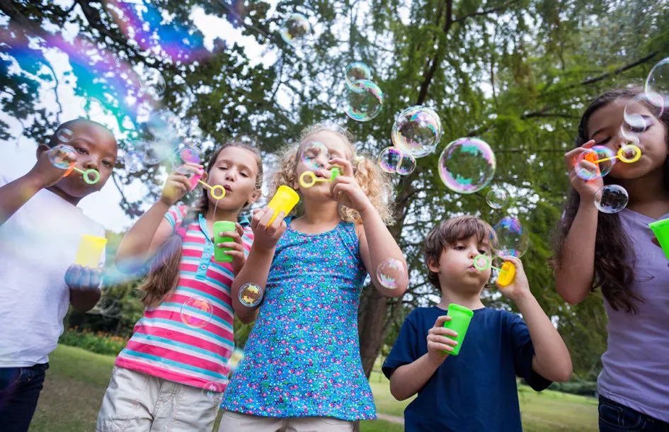 Kids blowing bubbles and having fun at one of the best summer camps in Silver Spring, MD