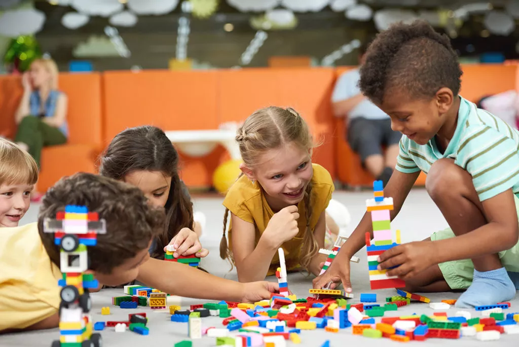 Kids playing with block toys, learning through play.