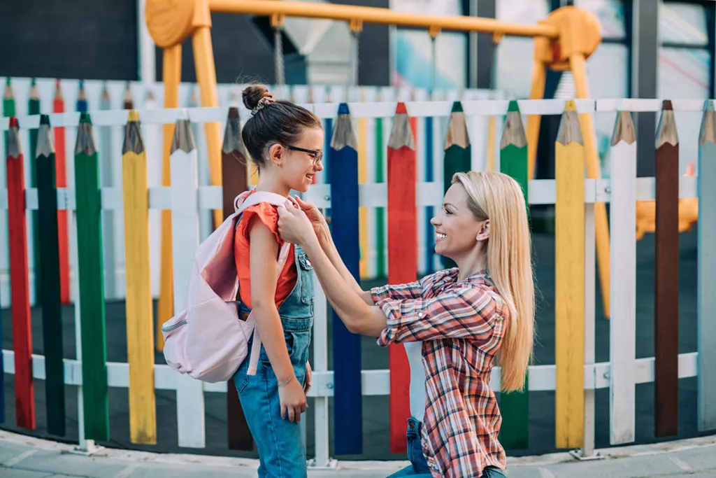 Mom saying goodbye to her daughter at preschool drop-off in Olney, MD.