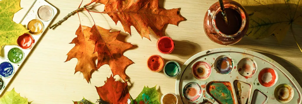 Fun and easy Fall crafts , leaves and paint on a table.
