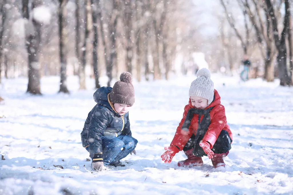 Kids going on a nature walk in the snow on winter break.