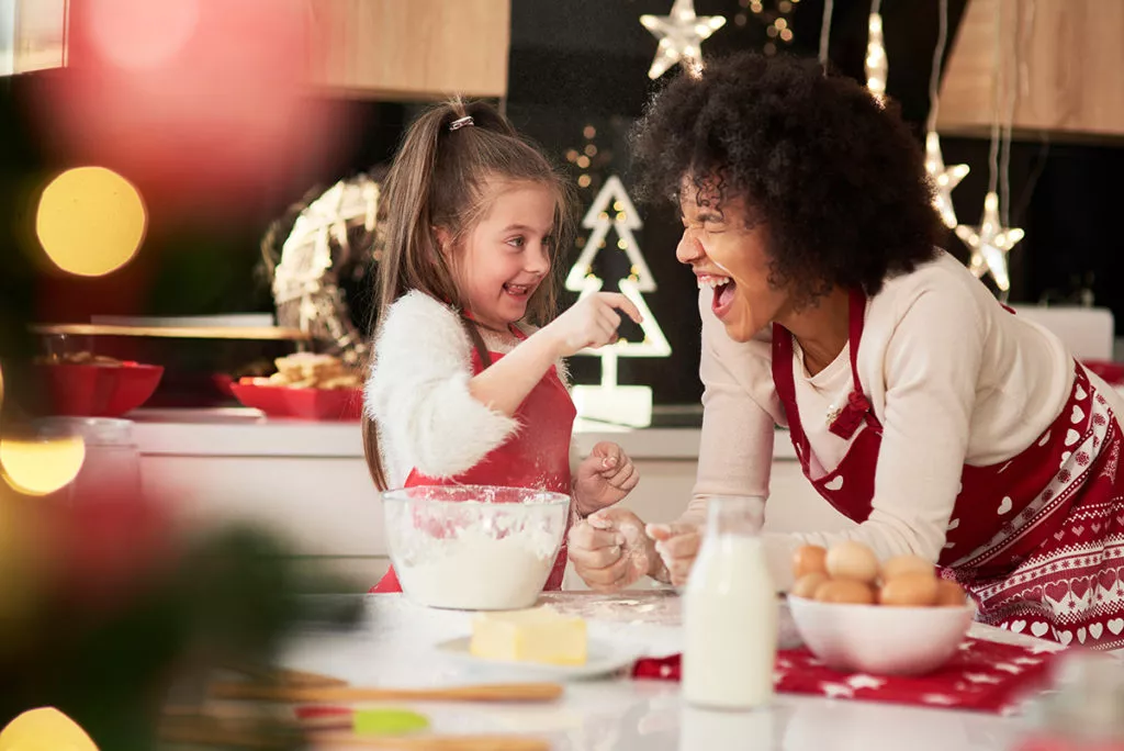 mother and daughter doing some holiday baking in the kitchen during winter break.