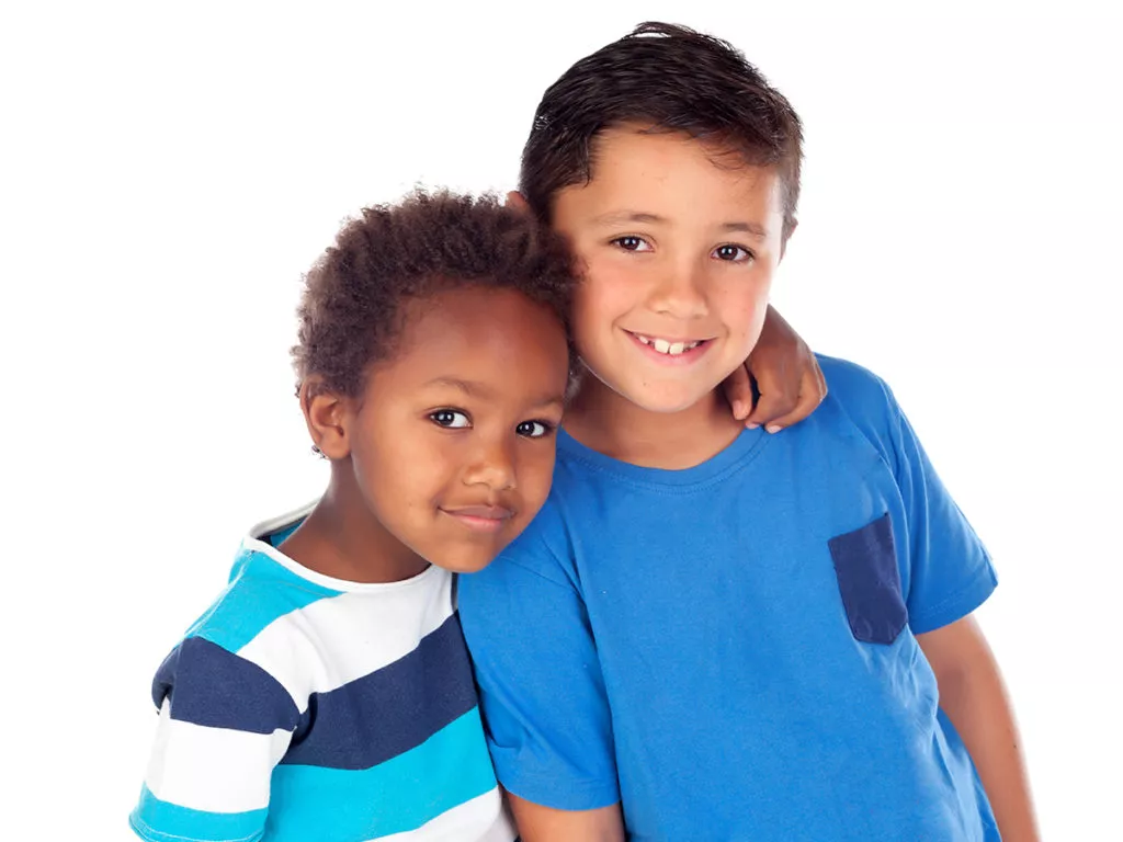 Two happy boys hugging.