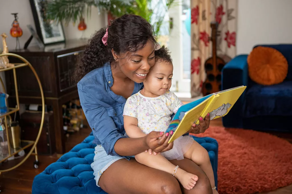 Mother reading to her toddler.