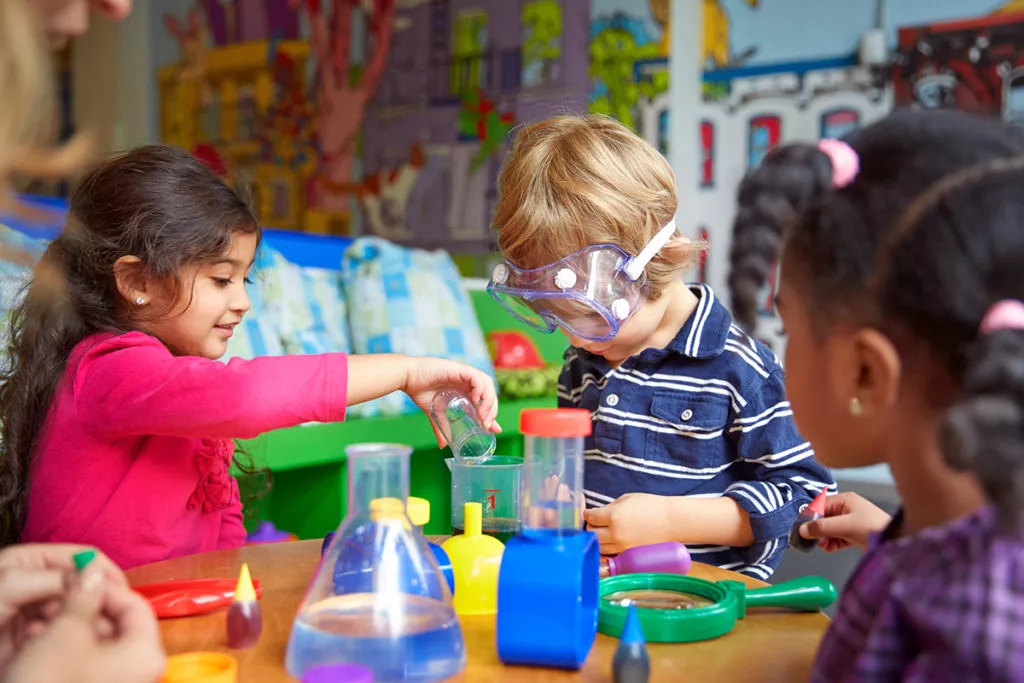 Kids workin on science experiments at a Silver Spring preschool and learning how to make friends.