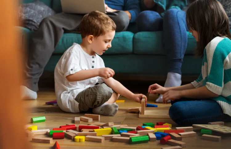 Little Boy Playing Toy Blocks as hands on math activities for preschoolers