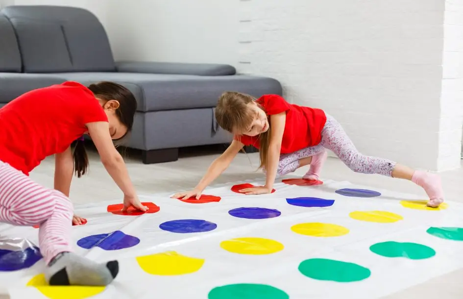 indoor activities for kids: two girls playing twister