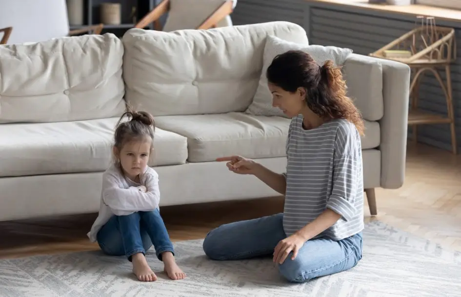 why children struggle with listening. mother scolding child while she pouts