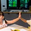 preschool friendships and why they matter, two preschoolers high five