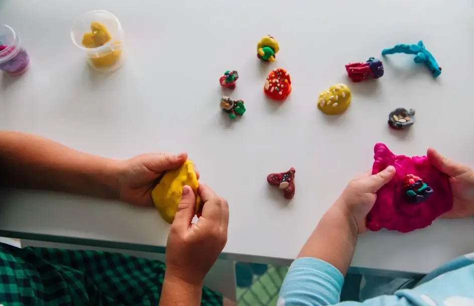 kids play with clay molding shapes, learning through play, fine motor activities for toddlers