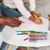 summer crafts for kids. dad and daughter close up, hands drawing